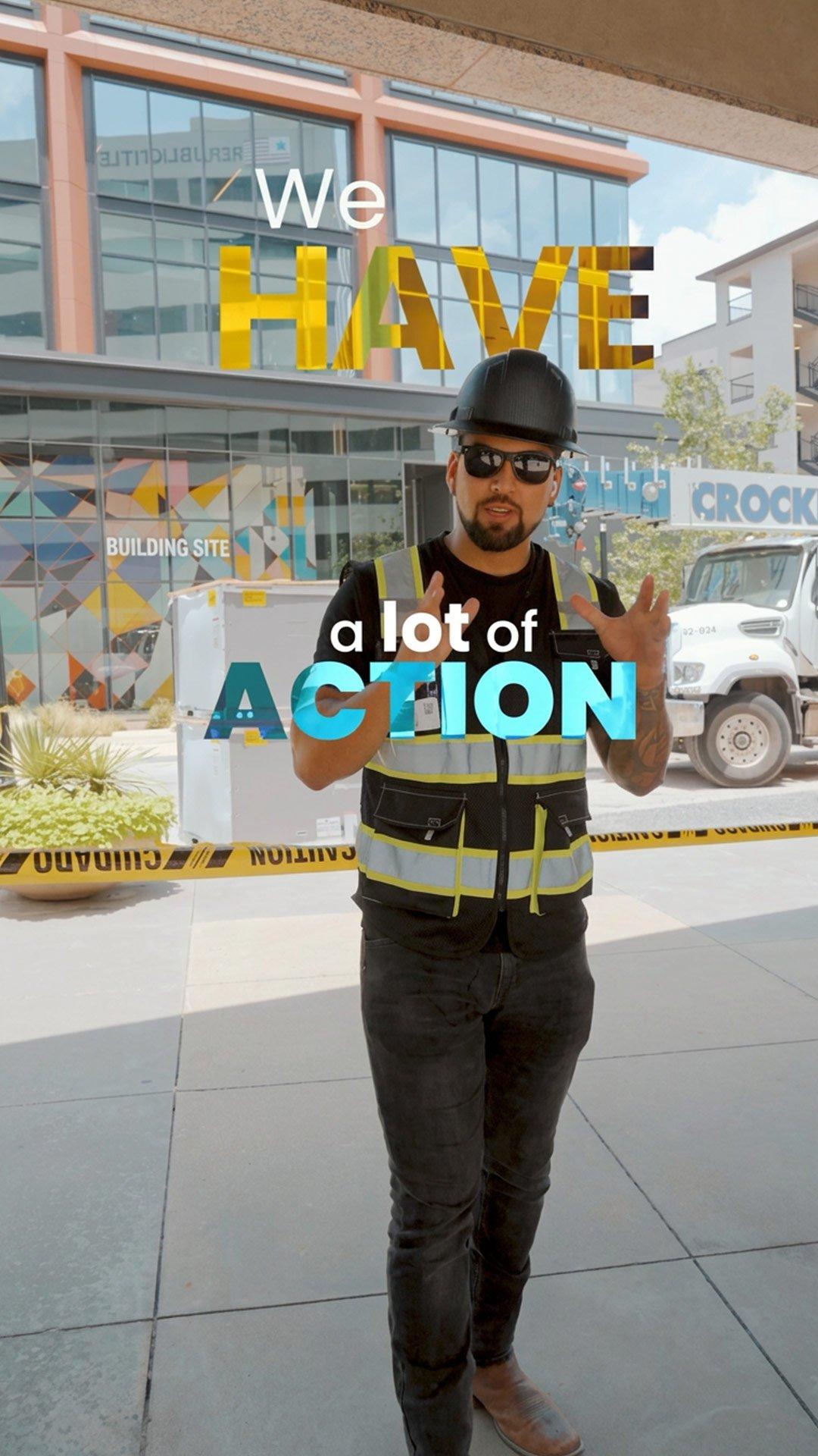 Worker in safety gear stands at a construction site beneath overlaid text reading “We HAVE a lot of ACTION.”